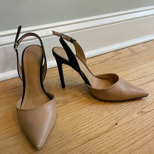 Nude and black pumps